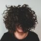 Frizzy hair texture on a woman with curly hair