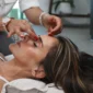 Woman relaxing during a facial treatment at a spa