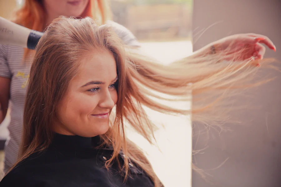 Woman having her hair blow dried at a salon